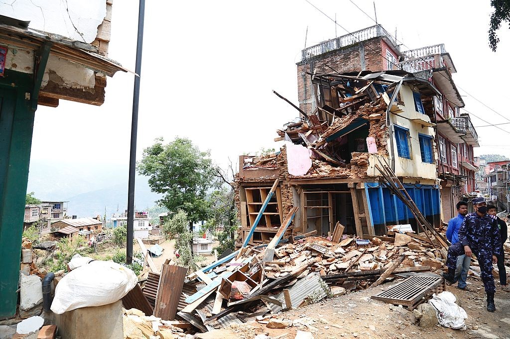 Collapsed_buildings_in_earthquake-hit_Chautara,_Nepal_(16693413433)_(2)